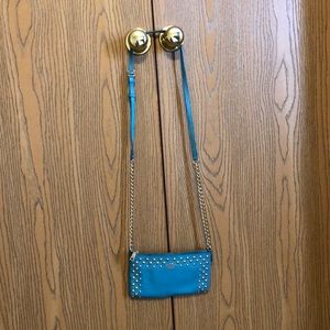 Turquoise coach purse.